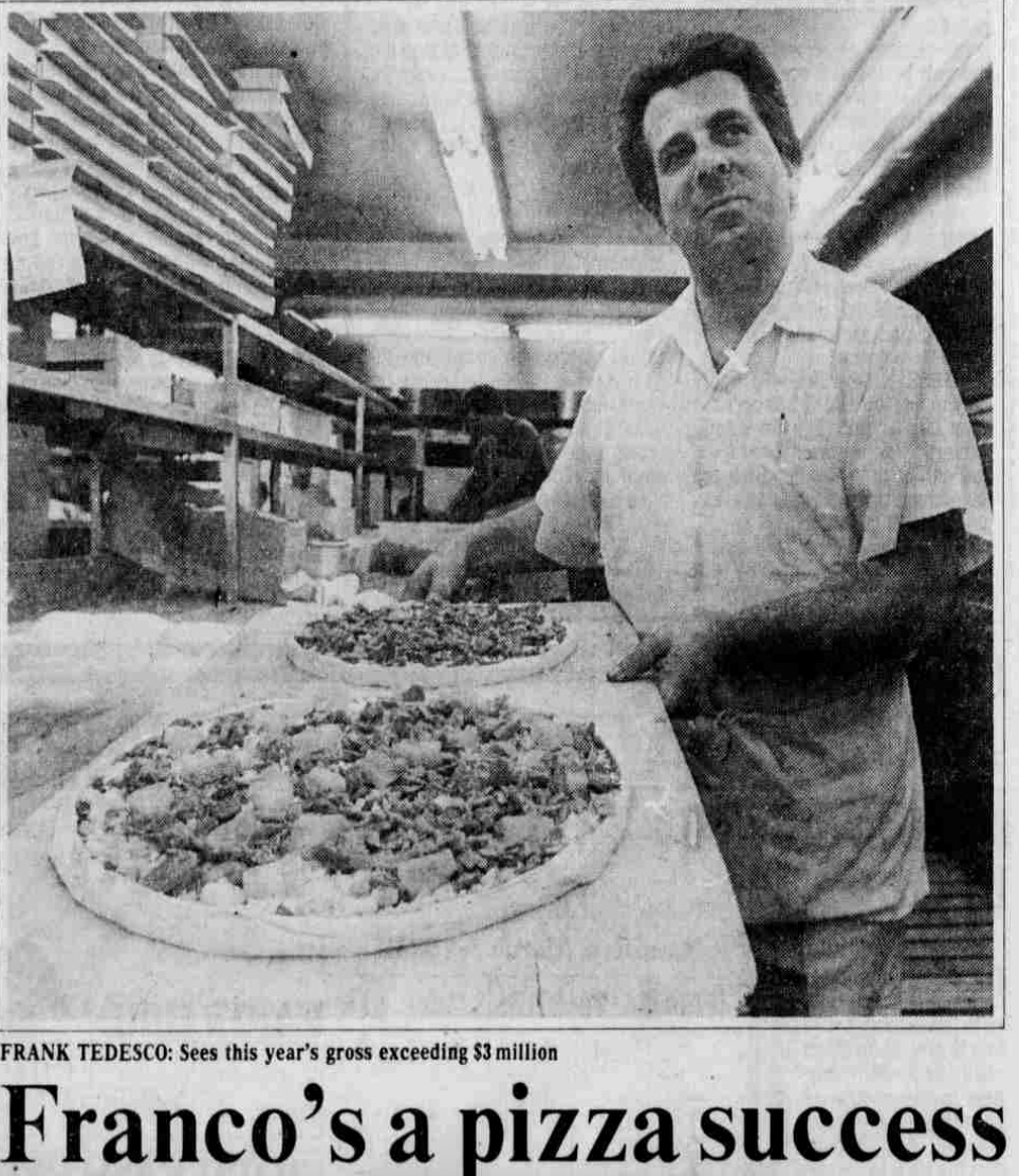 Frank Holding Pizza